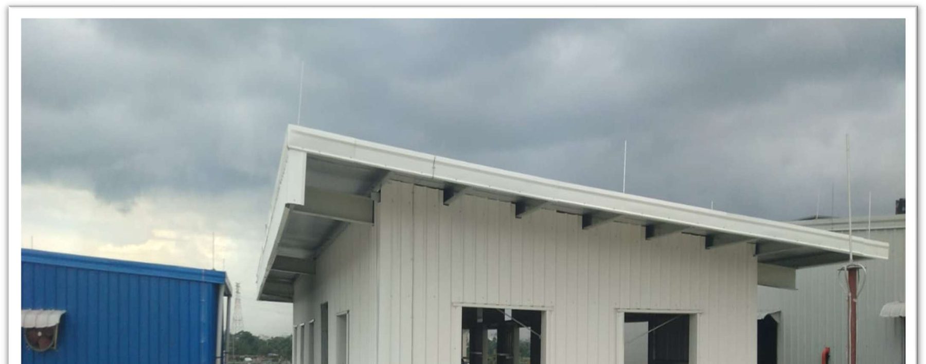 Completed building roofline and eave detail, insulated wall cladding