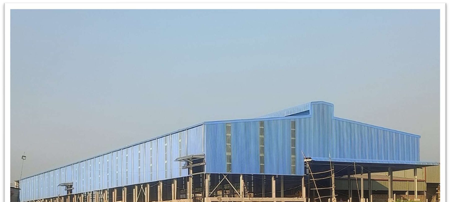 Riverside industrial steel building facility, blue cladding